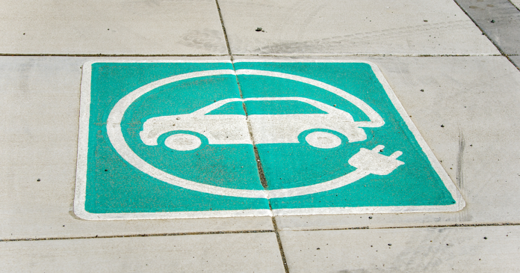 image of EV parking space painted on pavement - EV incentives post